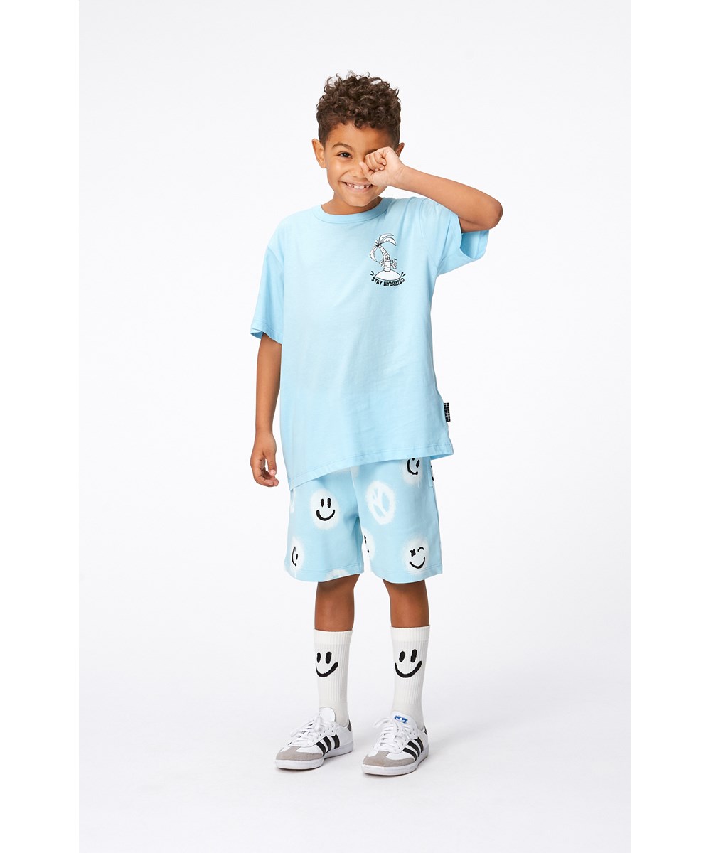 Adian - Pool Easy Peacy - Blauwe biolgosche joggingshort met witte print met smiley's en peace tekens