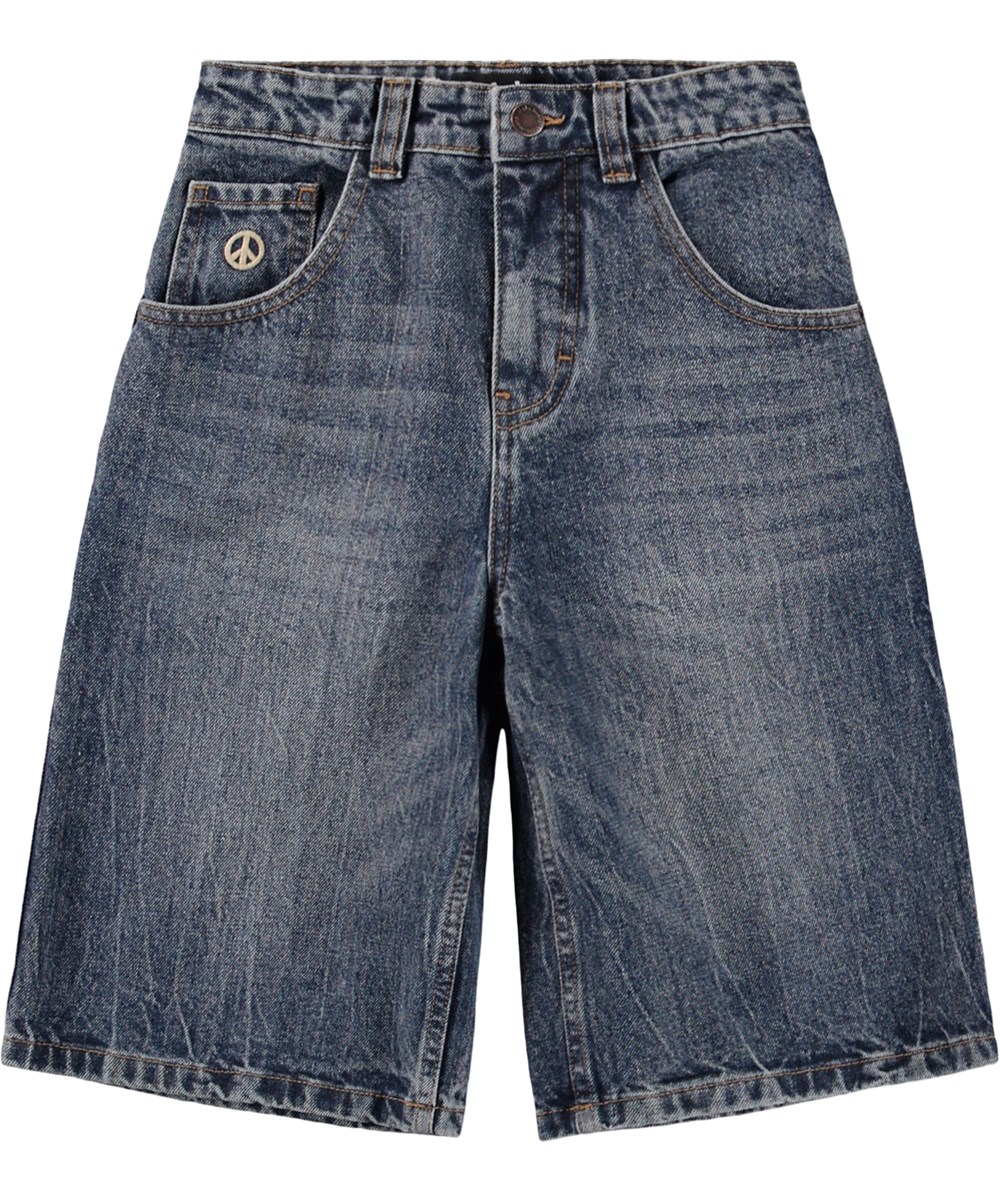 Alphie - Creased Indigo - Blauwe wijde korte spijkerbroek met een verstelbare taille ontworpen voor kinderen en gemaakt van biologisch katoen 