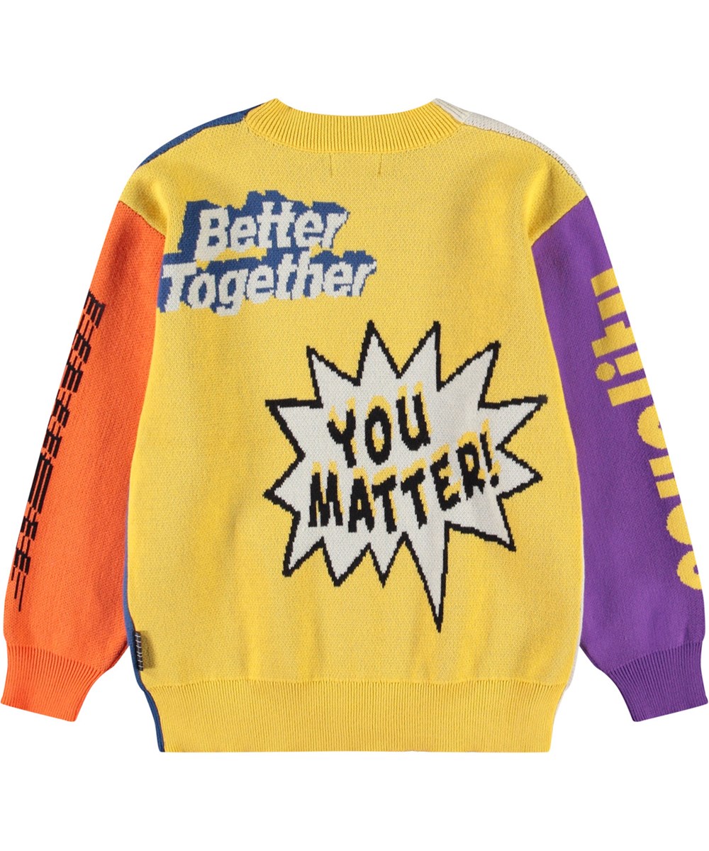 Burt - You Matter! - Kleurrijke gebreide kindervest van biologisch katoen met een v-hals, ribboord rond de hals, mouwen en onderkant en knopen aan de voorkant.