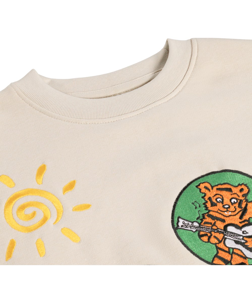 Mar - Patch Party - Beige kindersweater met een borduursel gemaakt van biologisch katoen met een borduursel