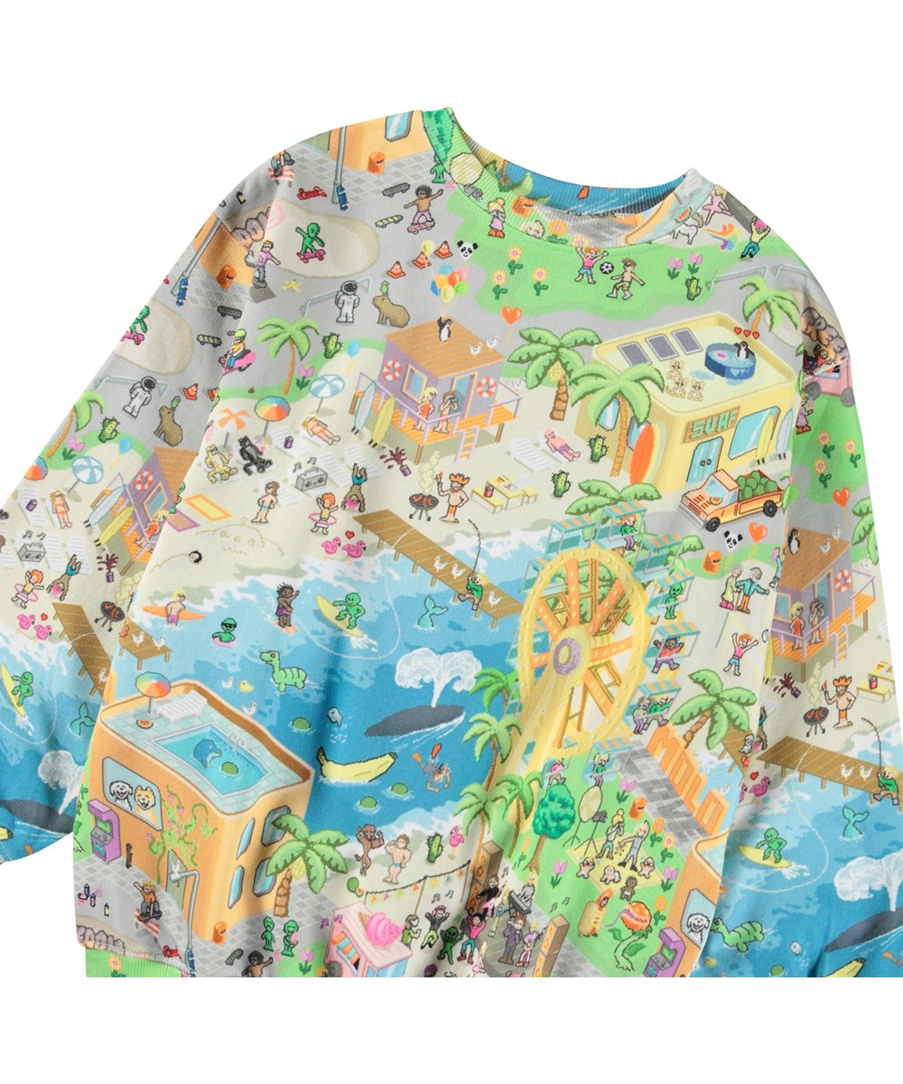 Monti - Pixelcation - Kleurrijke kindersweater van zacht biologisch katoen met print en ribboord rond de hals, mouwen en onderkant.