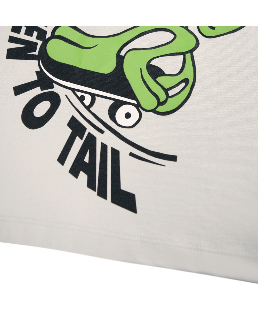 Rodney - A Lien To Tail - Beige oversized kinder t-shirt gemaakt van zacht biologisch katoen met een ribboord rond de hals.