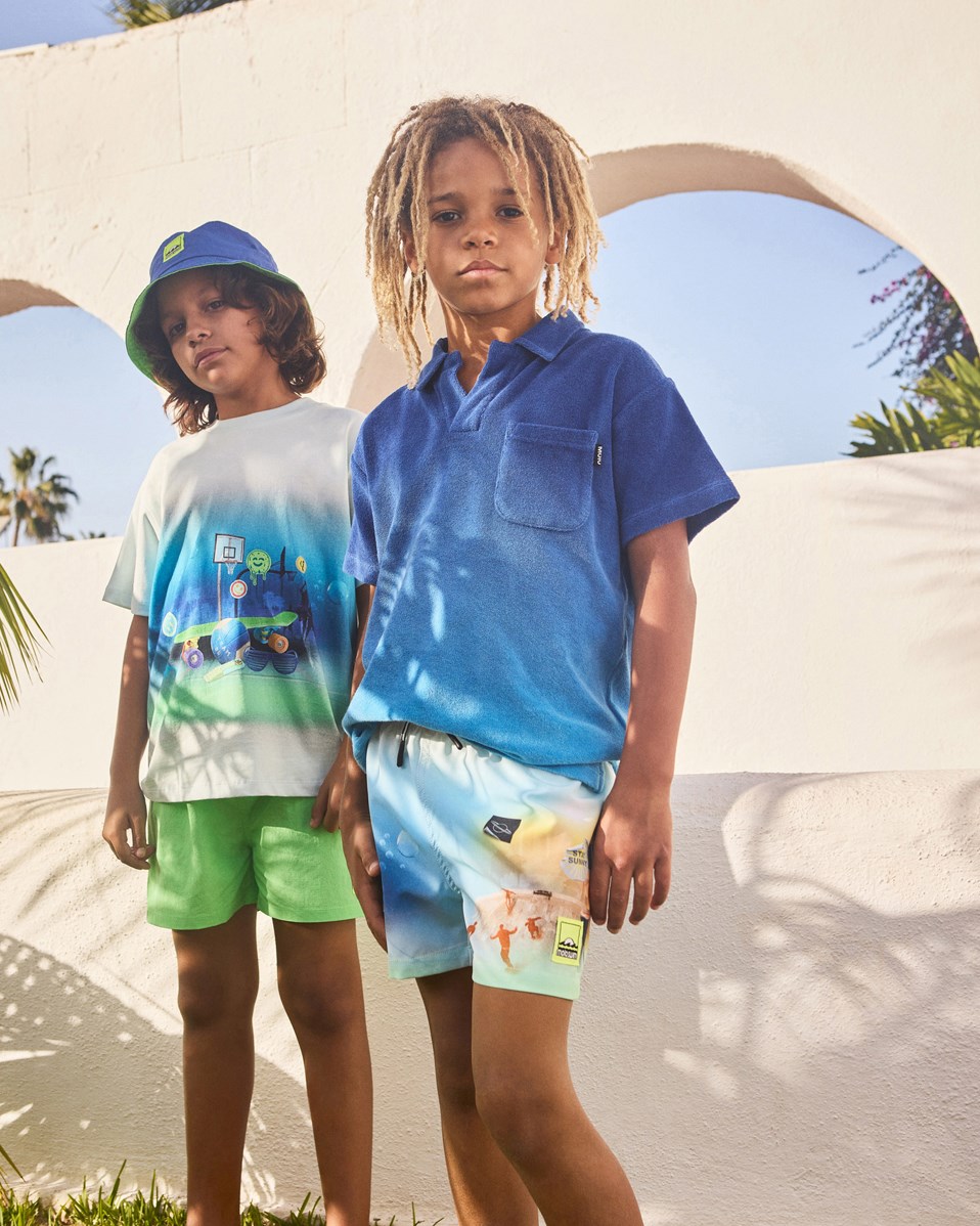 Rodney - My Childhood - Oversized lichtblauw kinder t-shirt van biologisch katoen met korte mouwen en ribboord rond de hals.