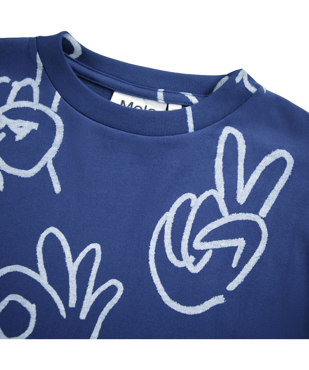Rube - Handdrawn - Blauwe longsleeve voor kinderen gemaakt van biologisch katoen met een ribboord rond de hals en een print van schattige en grappige handgebaren.