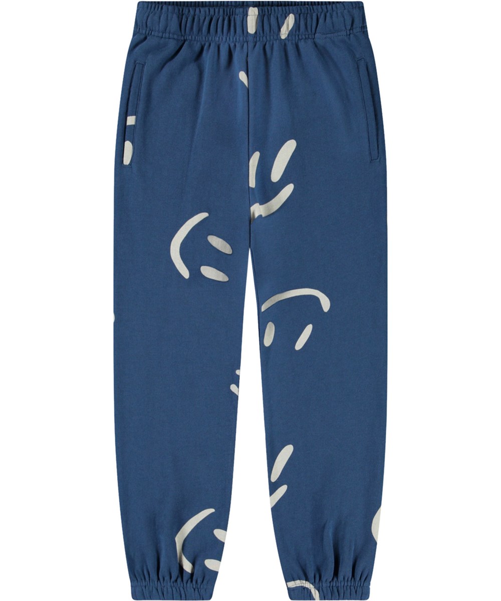 Allen - Big Smiles Blue - Blaue Hosen aus Öko-Baumwolle mit lächelnden Gesichtern für Kinder.