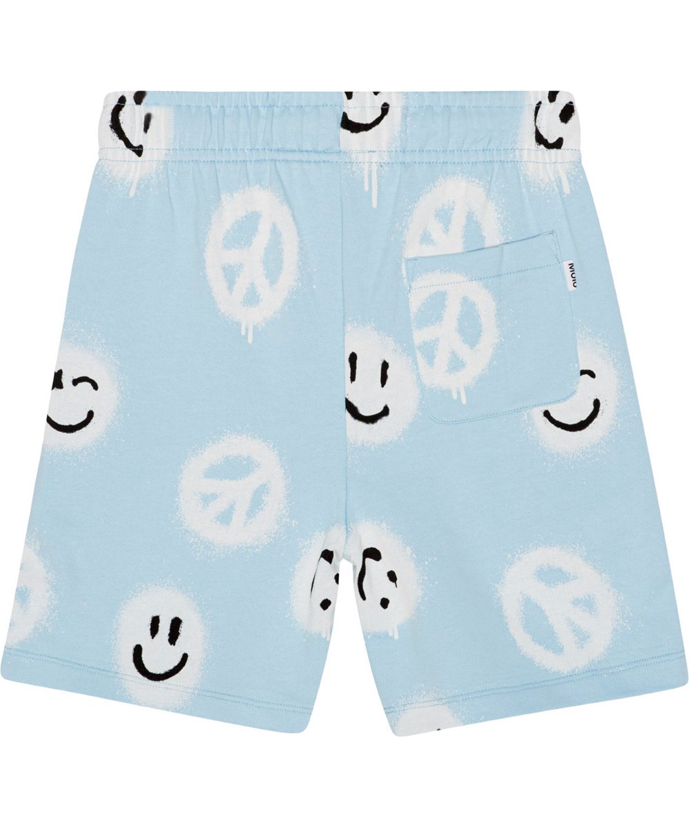 Adian - Pool Easy Peacy - Blaue Öko-Sweatshorts mit weißem Allover-Print mit lächelnden Gesichtern und Peace-Zeichen