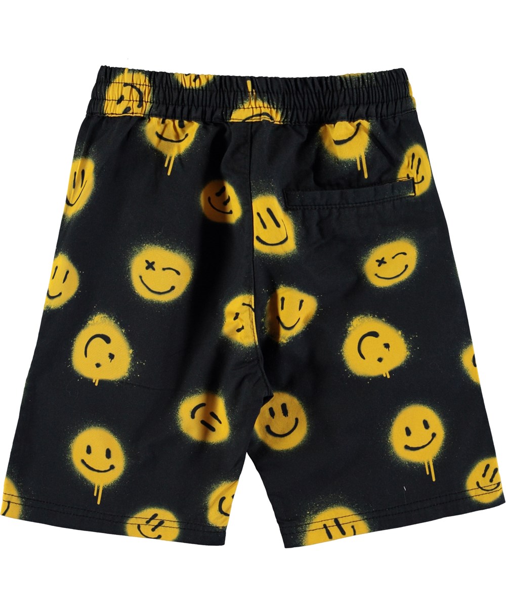 Avart - Smiles - Schwarze Shorts mit gelben Graffiti-Smileys.