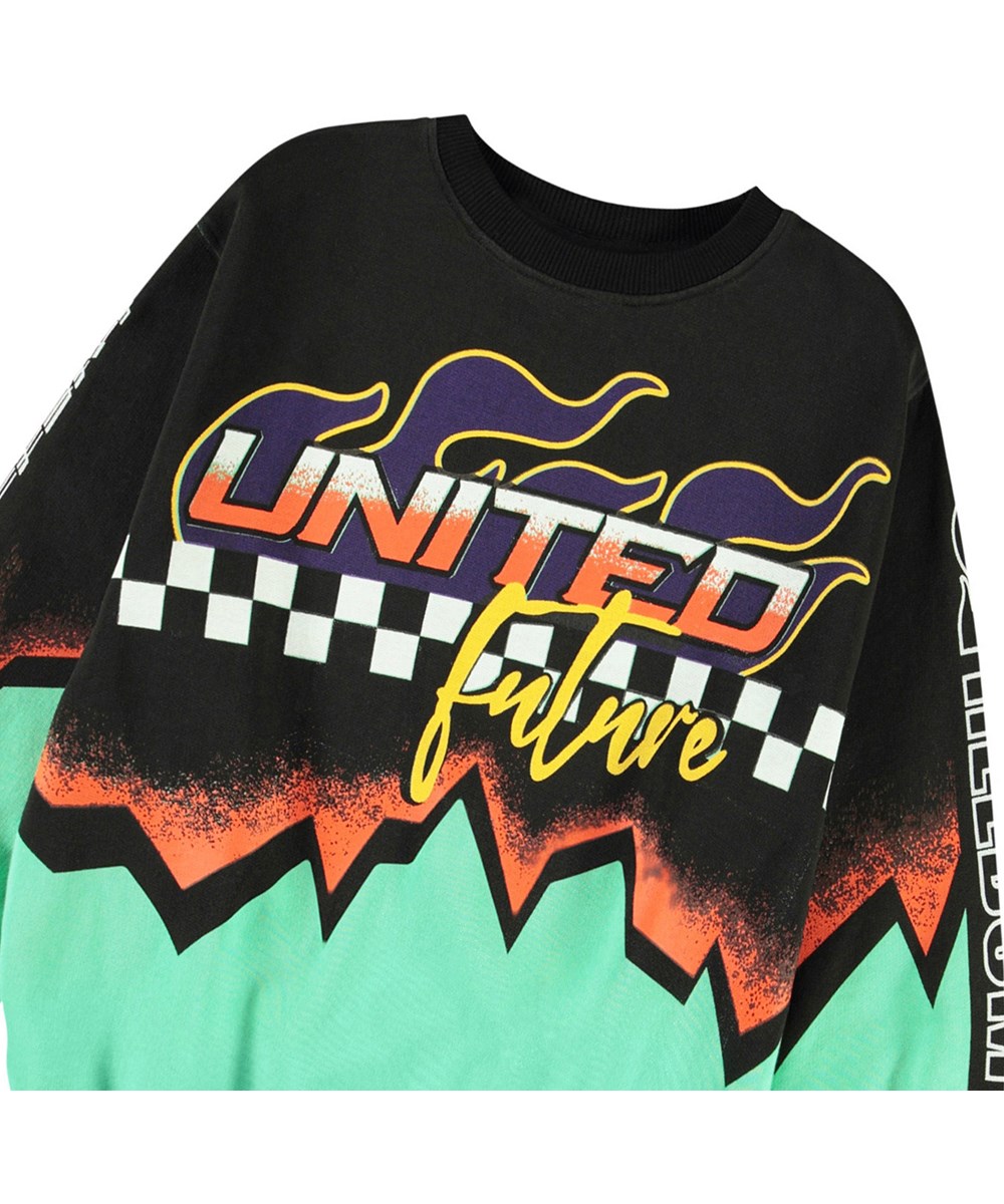 Monti - Future United - Schwarzer und grüner Pullover mit Druck für Kinder aus weicher, Ökologischer Baumwolle mit gerippten Kanten am Hals, an den Ärmeln und am unteren Saum des Pullovers.