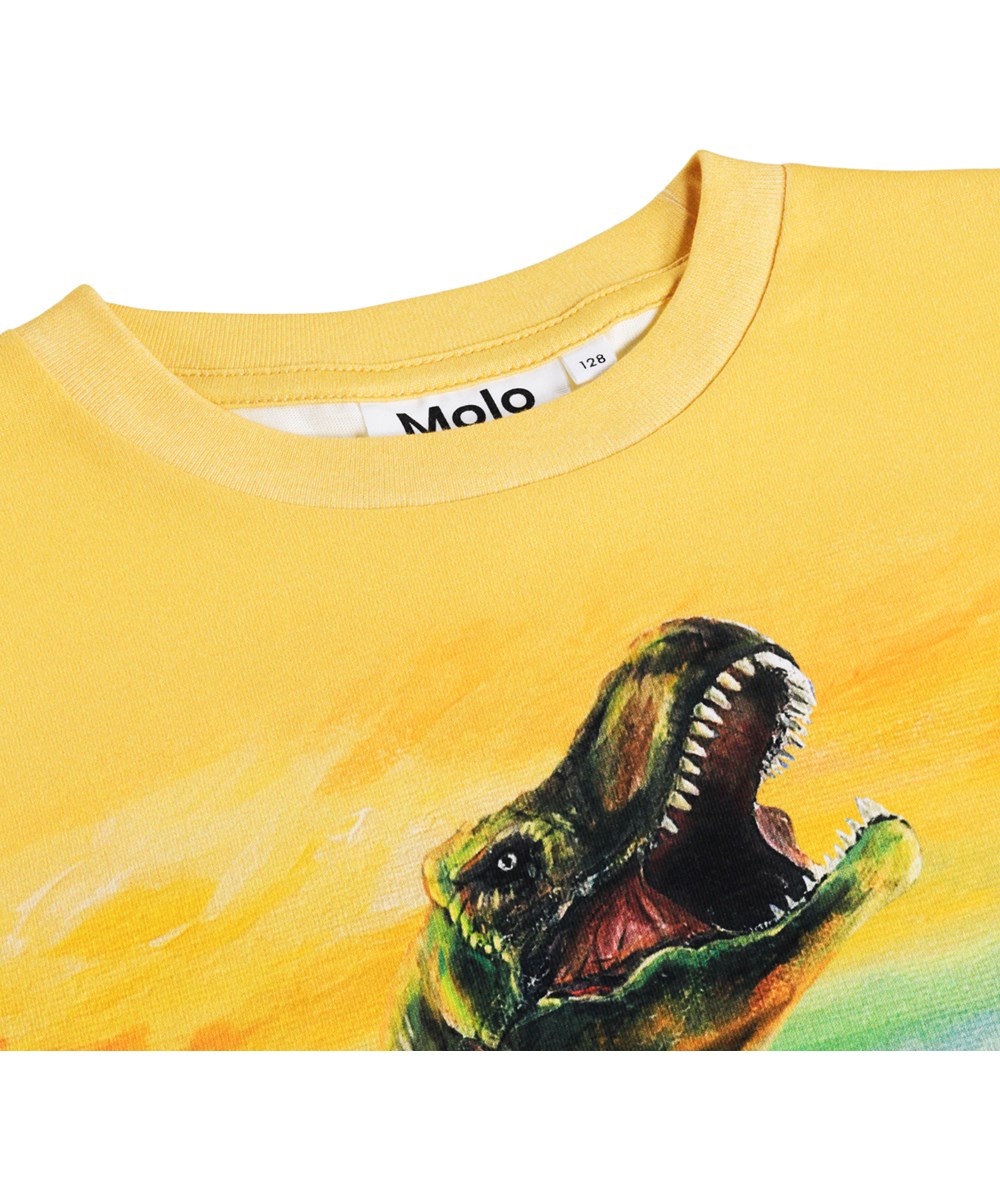 Riley - Dino Art - Gelbes T-Shirt für Kinder aus Öko-Baumwolle