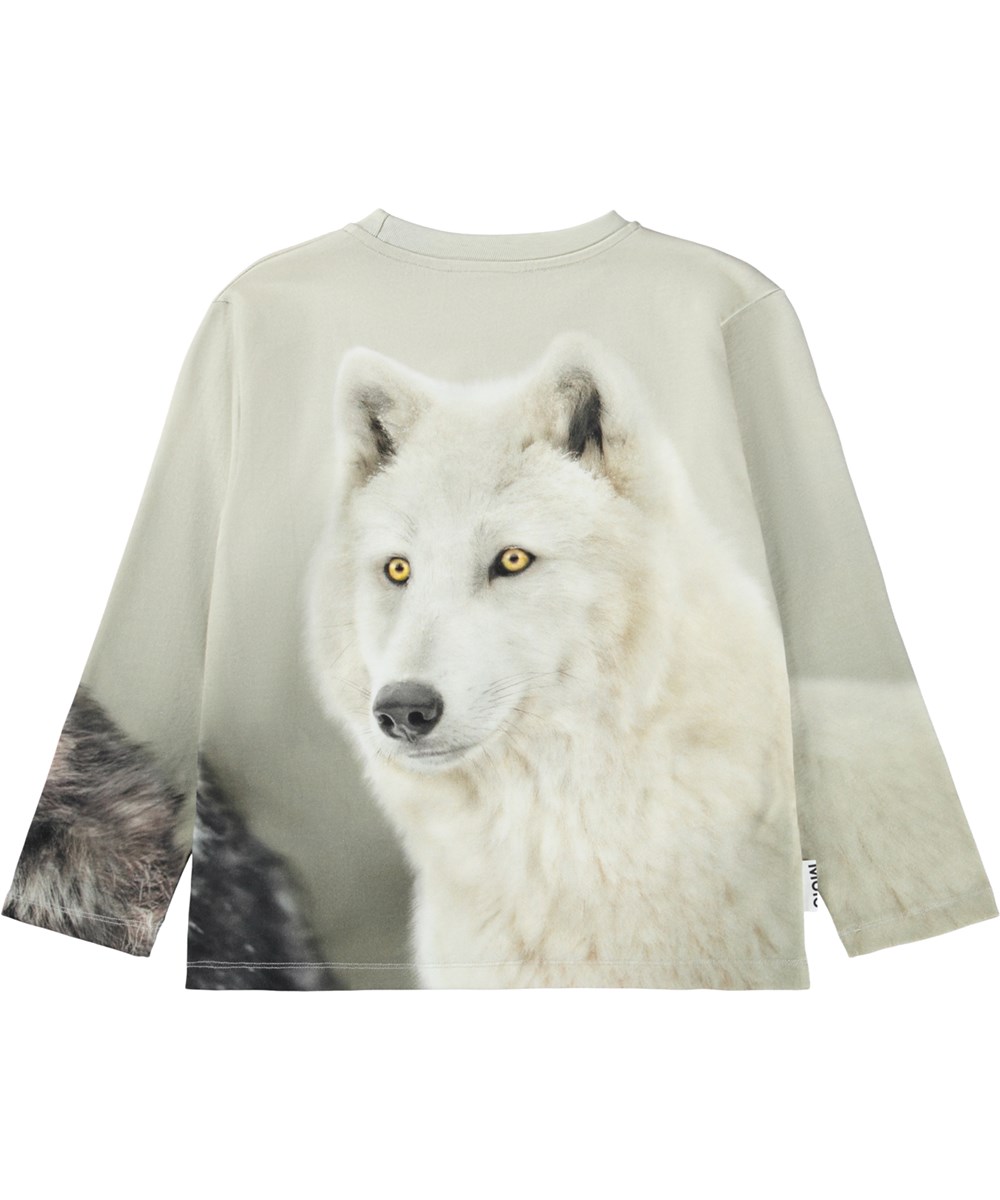 Rollo - Two Wolves - Beiges Langarmshirt für Kinder aus weicher Öko-Baumwolle mit geripptem Ausschnitt und einem Druck von zwei Wölfen.