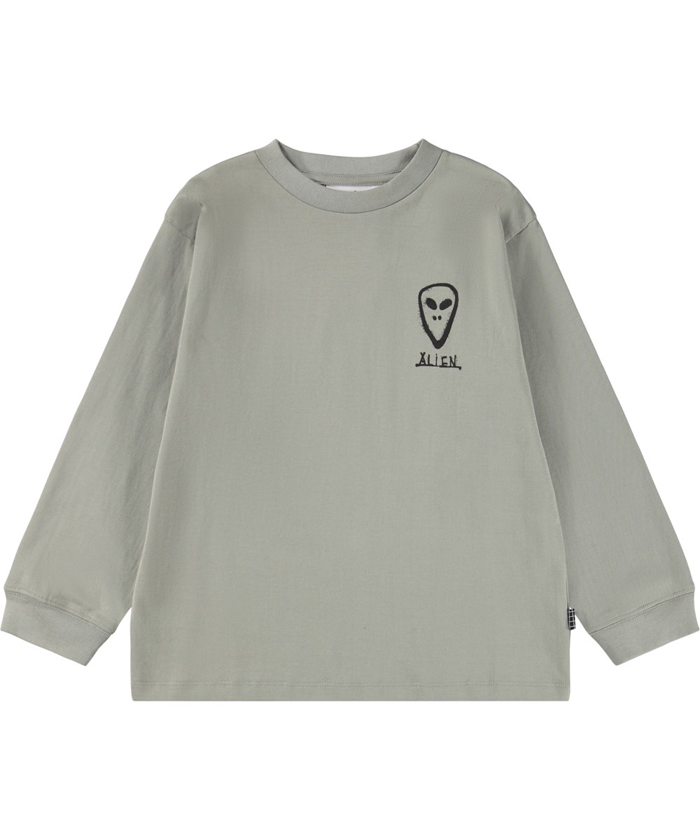 Rube - Forest Fog - Khakifarbenes Langarmshirt für Kinder aus Öko-Baumwolle mit geripptem Ausschnitt und einem grafisch bemalten Alien-Gesicht auf Vorder- und Rückseite.