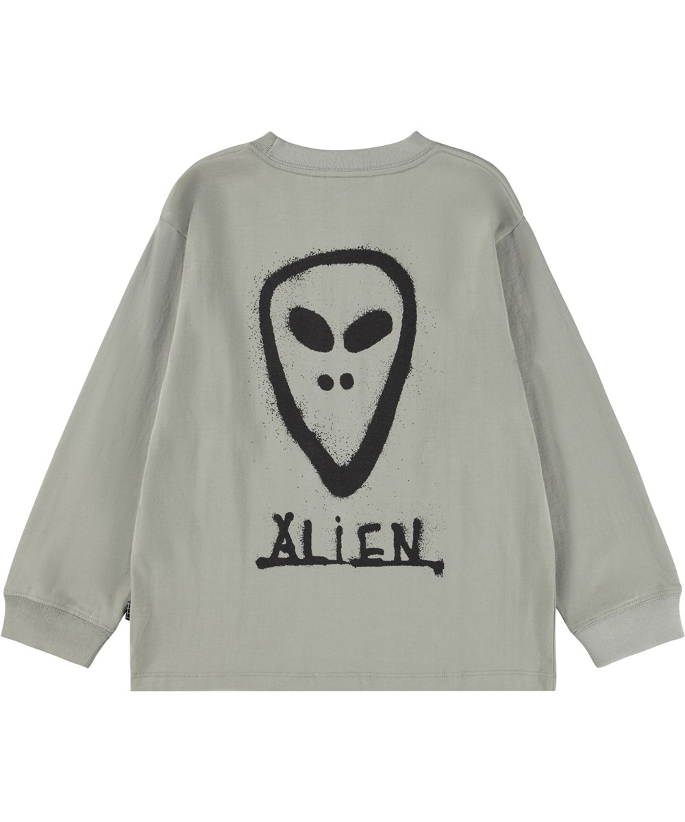 Rube - Forest Fog - Khakifarbenes Langarmshirt für Kinder aus Öko-Baumwolle mit geripptem Ausschnitt und einem grafisch bemalten Alien-Gesicht auf Vorder- und Rückseite.