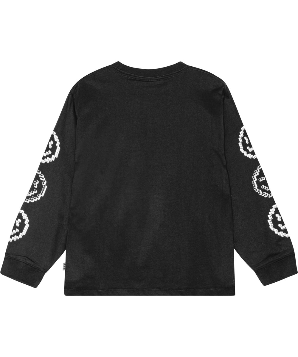 Rube - Smiling Pixels - Schwarze Bluse mit weißen pixeligen Gesichtern auf den Ärmeln bedruckt.