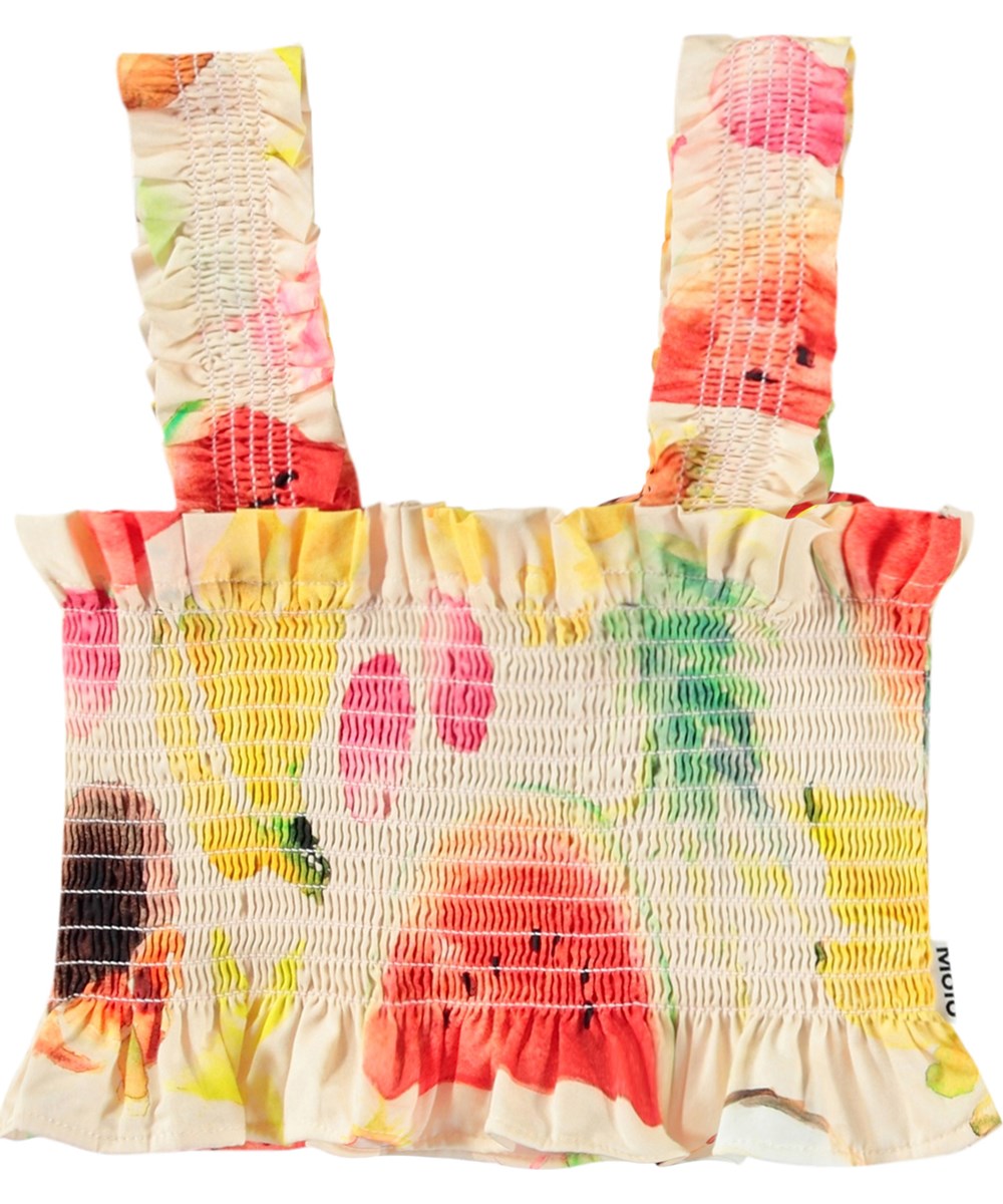 Rolfia - Painted Fruits - Off-weißes Crop-Top für Kinder aus Öko-Baumwolle mit einem Druck bunter exotischer Früchte.
