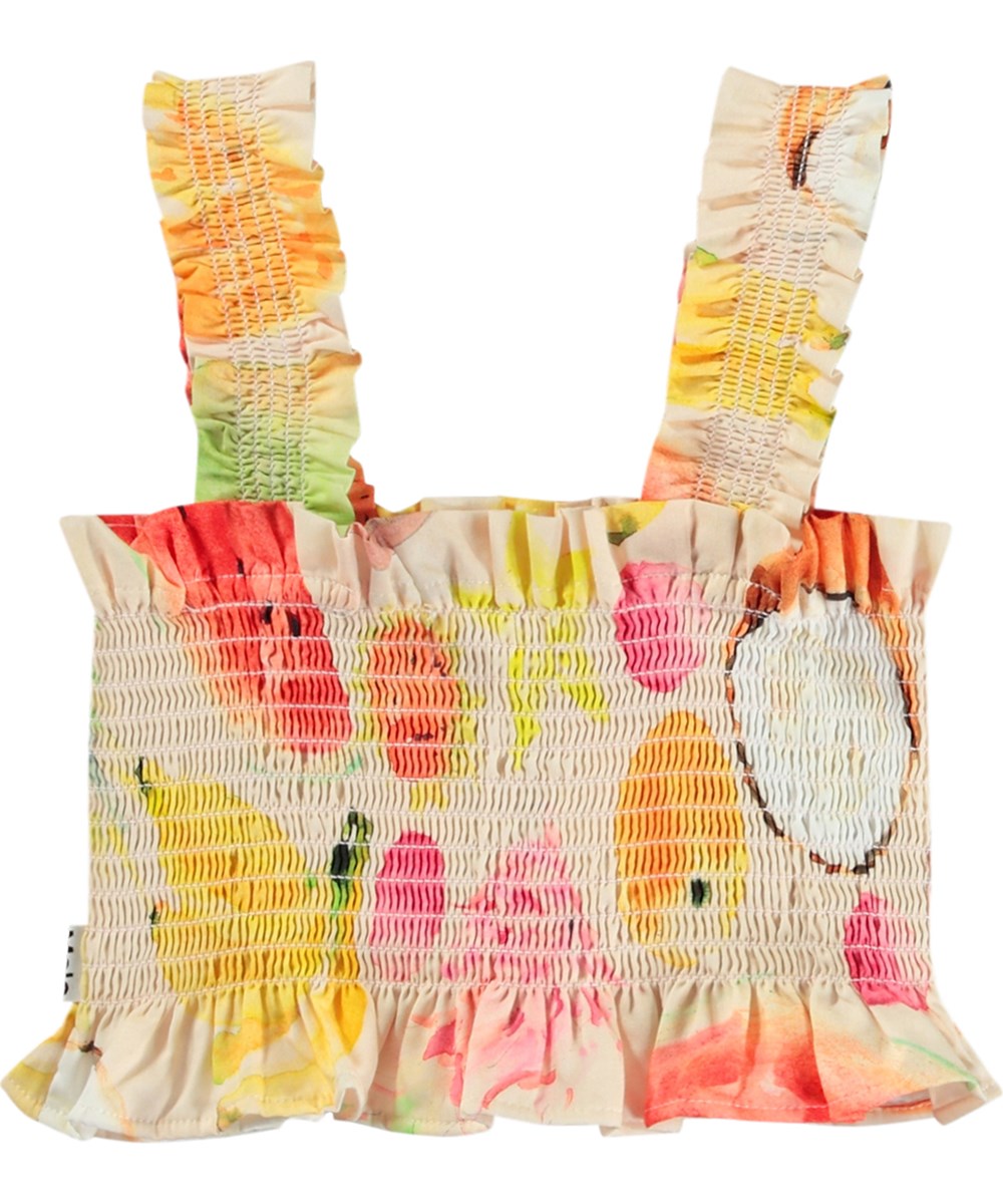 Rolfia - Painted Fruits - Off-weißes Crop-Top für Kinder aus Öko-Baumwolle mit einem Druck bunter exotischer Früchte.