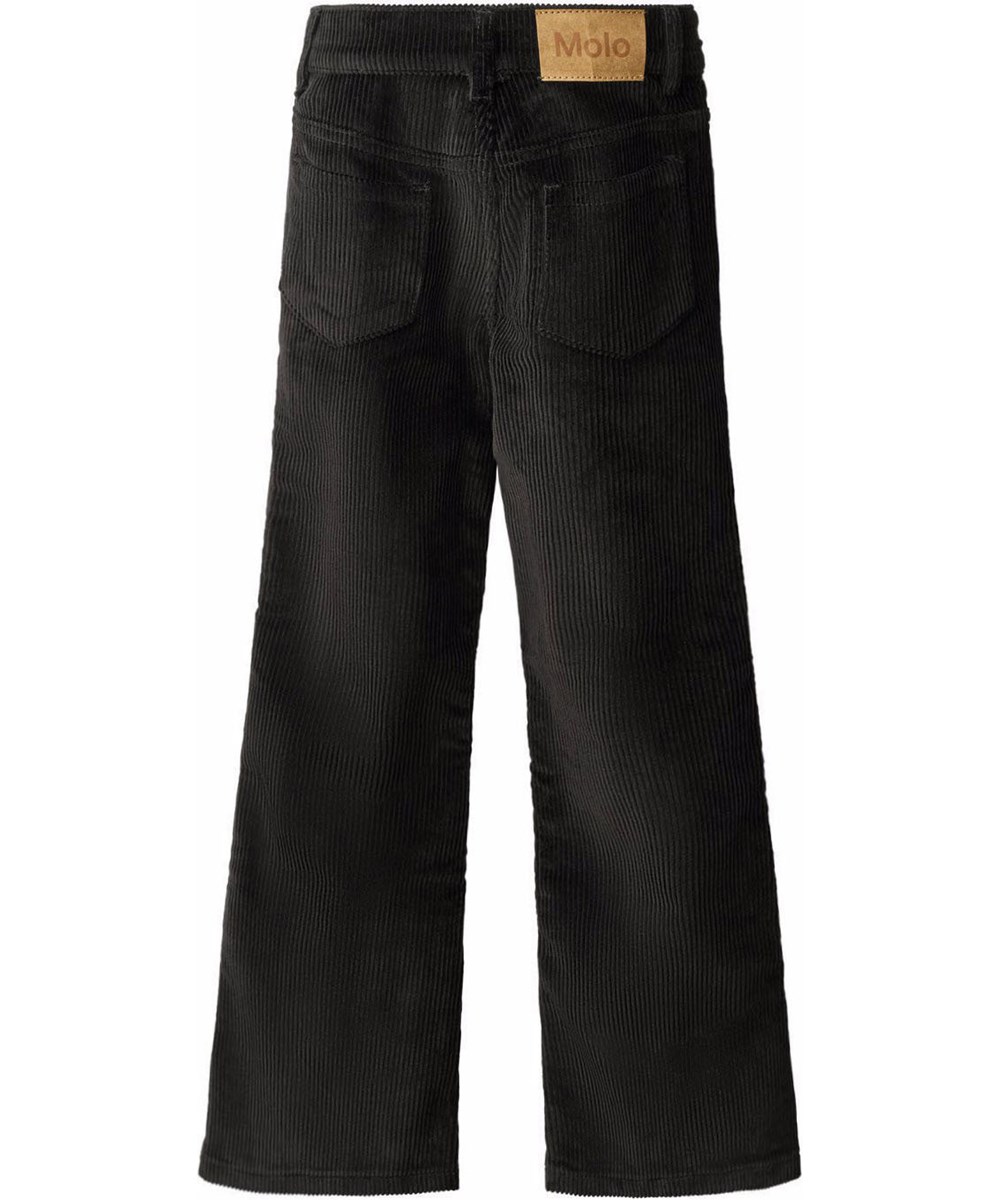 Aida - Black - Schwarze Hosen für Kinder aus weichem Baumwoll-Velvet in einer trompetenförmigen Silhouette.