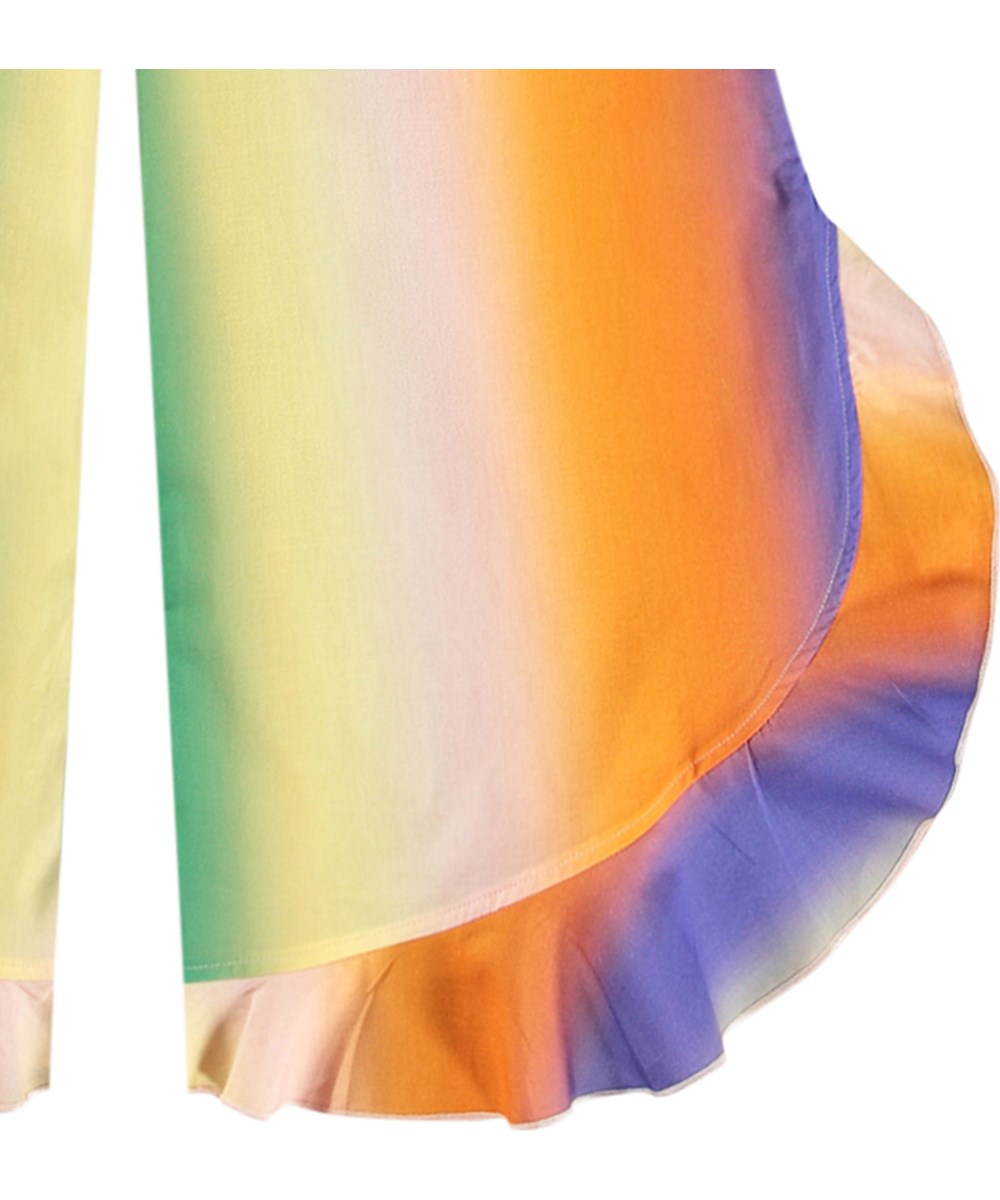 Aretha - Big Rainbow - Luftige Hosen für Kinder mit Rüschenkante aus Öko-Baumwolle.