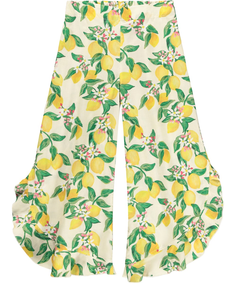 Aretha - Citrus - Gelbe, lockere Hosen für Kinder aus Bio-Baumwolle mit Zitrusfrüchte-Print.