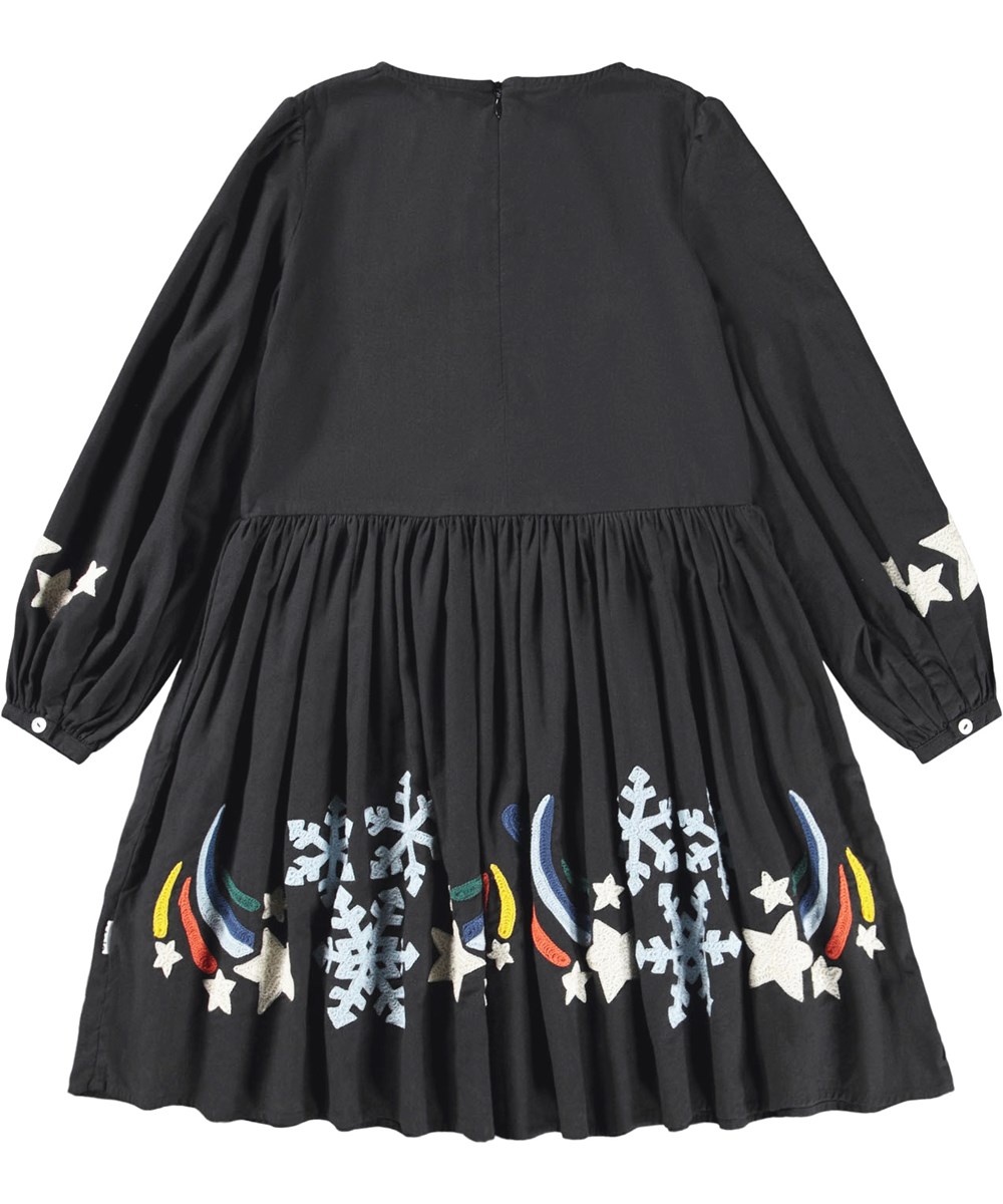 Camma - Shooting Star - Knielanges schwarzes Kleid für Kinder aus Baumwolle mit bestickten Sternschnuppen und Eiskristallen.