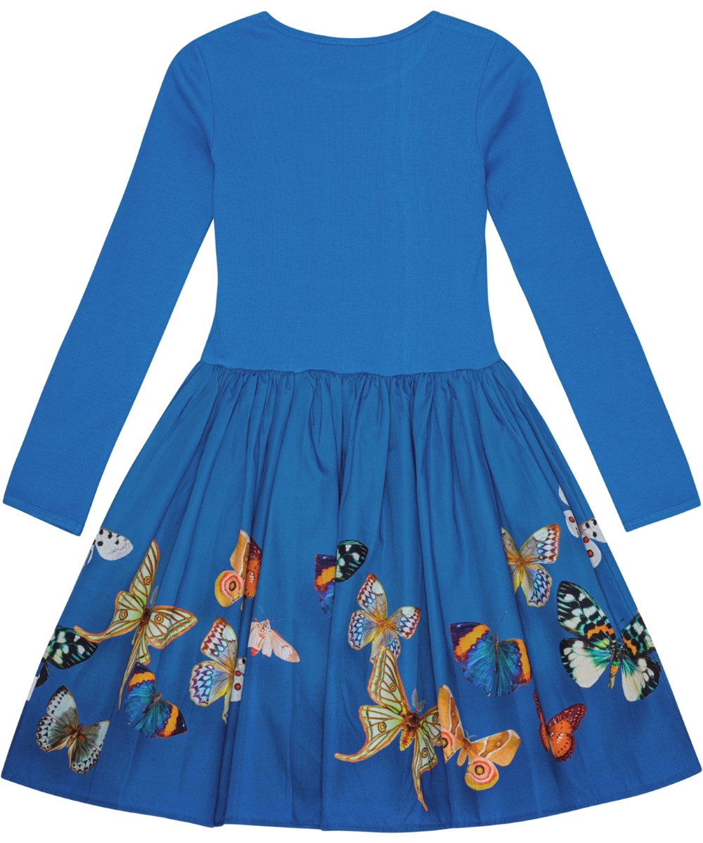 Casie - Night Butterflies - Blaues Kleid aus Öko-Baumwolle mit geripptem Jersey-Oberteil und Schmetterlingsmuster.