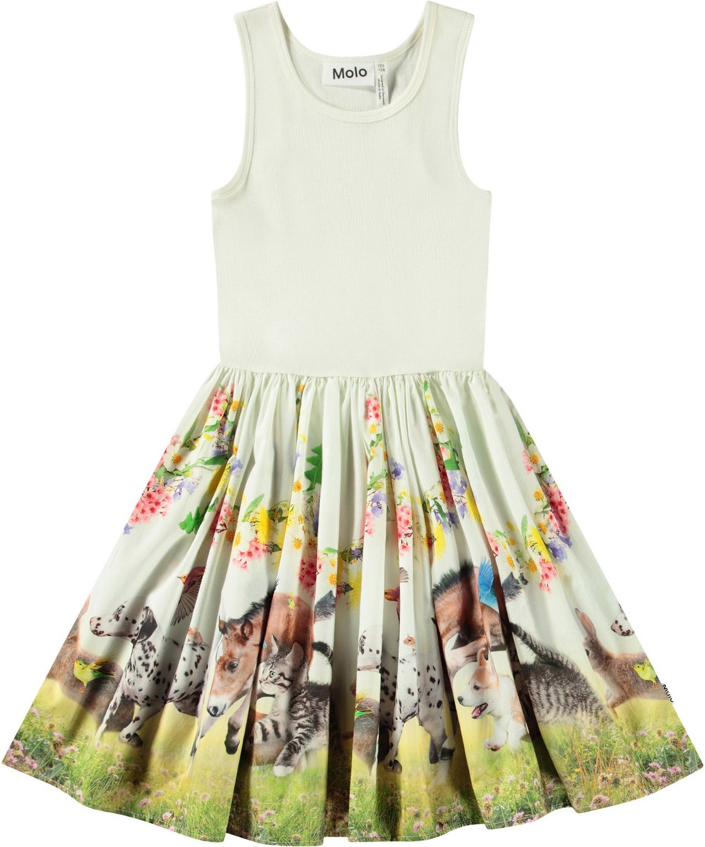 Cassandra - Joy Run - Cremefarbenes Kleid für Kinder aus Öko-Baumwolle mit einem eng anliegenden gerippten Jersey-Oberteil und einem Popeline-Rock.