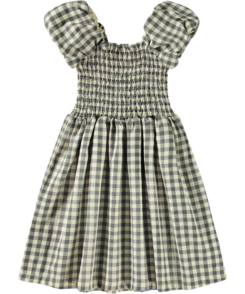 Cherisla - Sun Check - Kariertes knielanges Kleid für Kinder in Öko-Baumwolle mit einem quadratischen Ausschnitt in Beige und Grau.