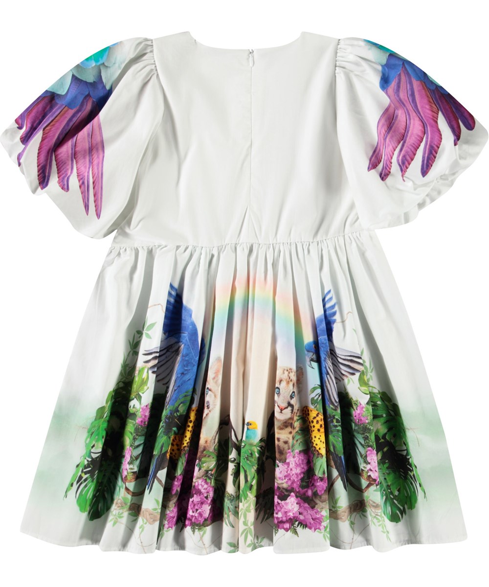 Chica - In The Jungle - Weißes knielanges Kleid für Kinder aus Öko-Baumwolle mit Puffärmeln und Rundhalsausschnitt.