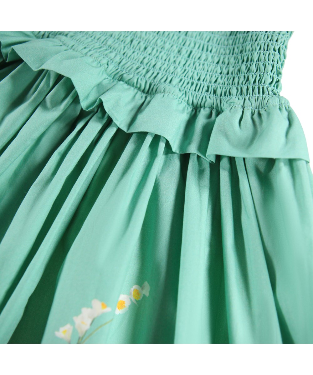 Chipie - Flower Garden - Grünes Kleid für Kinder aus Öko-Baumwollpopeline mit Blumenmuster.