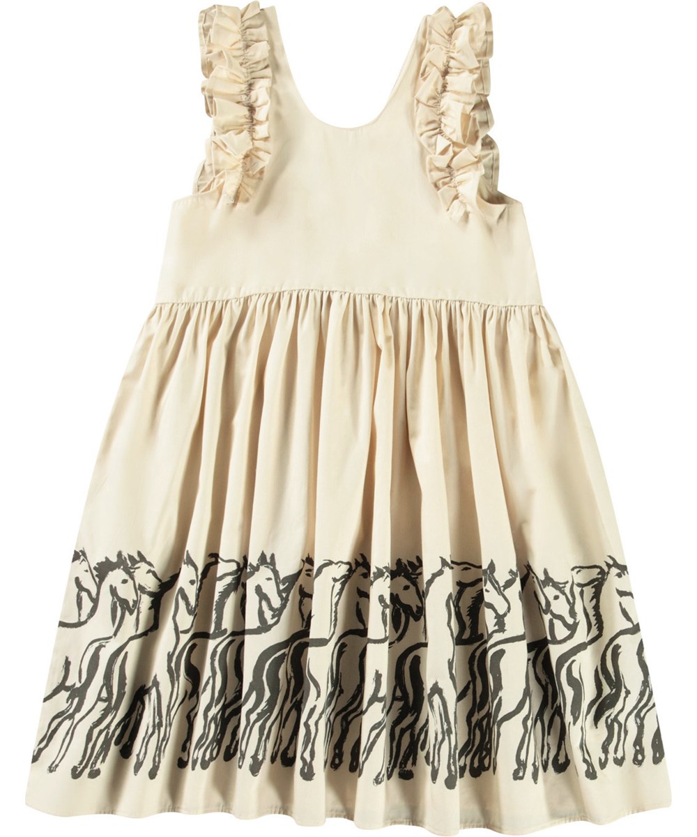 Cicely - Horse Border - Beiges knielanges Kleid für Kinder aus Öko-Baumwolle mit Rüschenbesatz an den Ärmelausschnitten.