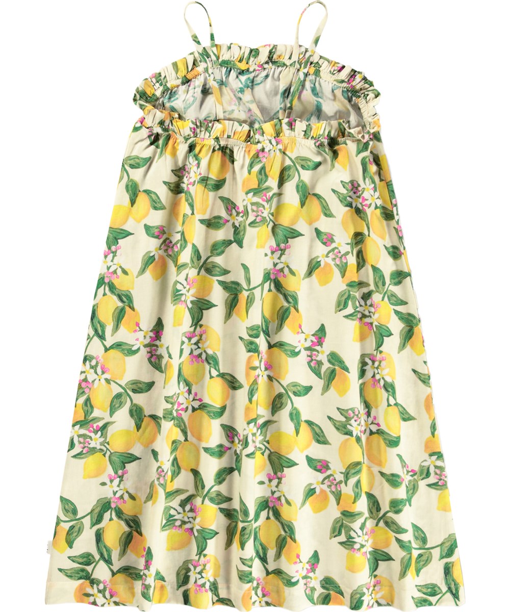 Connie - Citrus - Gelbes Trägerkleid für Kinder mit Zitrusdruck aus Bio-Baumwolle.