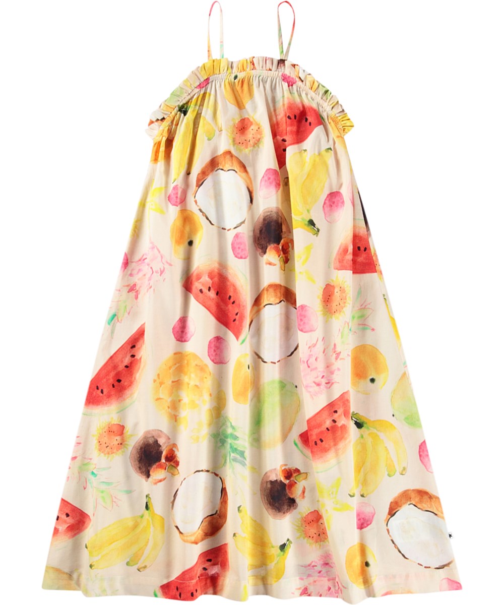 Connie - Painted Fruits - Beiges lockeres Kleid für Kinder aus Öko-Baumwolle mit einem Druck von bunten exotischen Früchten, dünnen Trägern und gerüschtem Saum.