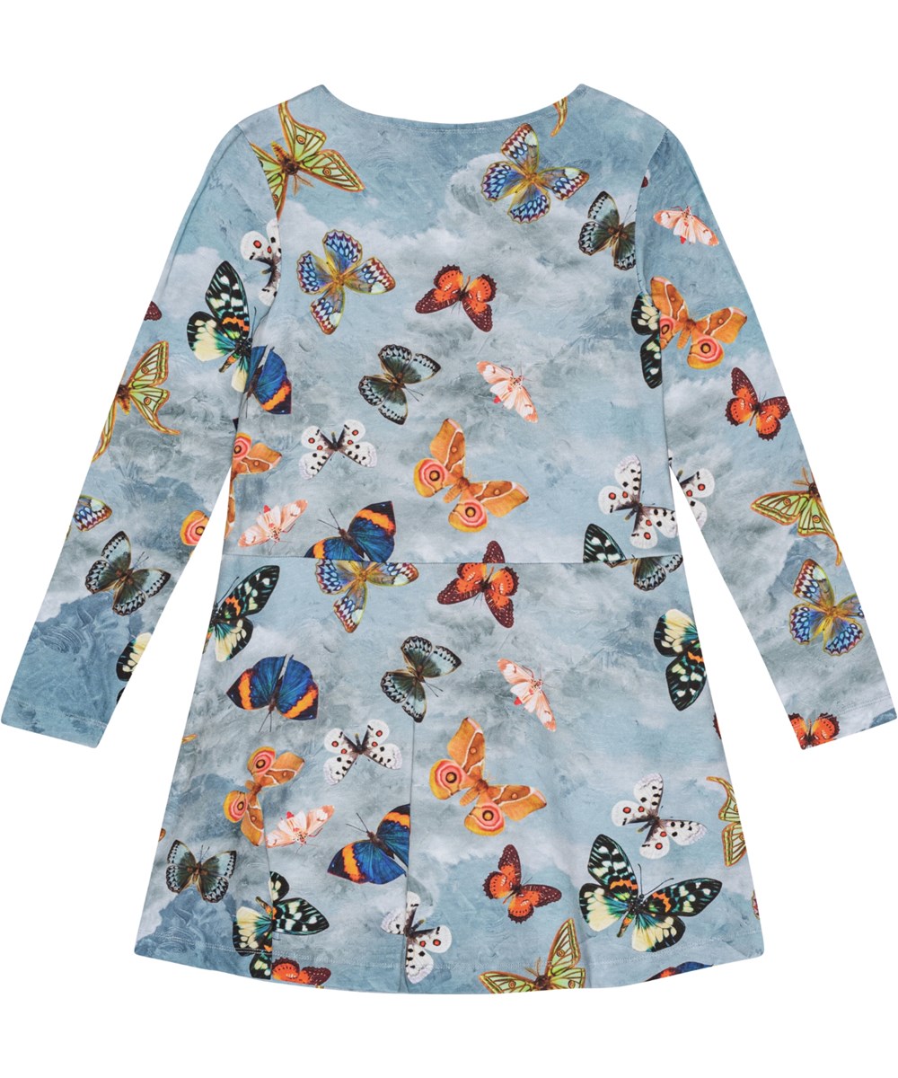 Corelie - Les Papillons - Blaues langärmeliges Öko-Baumwollkleid mit Schmetterlingsmuster, knielang.