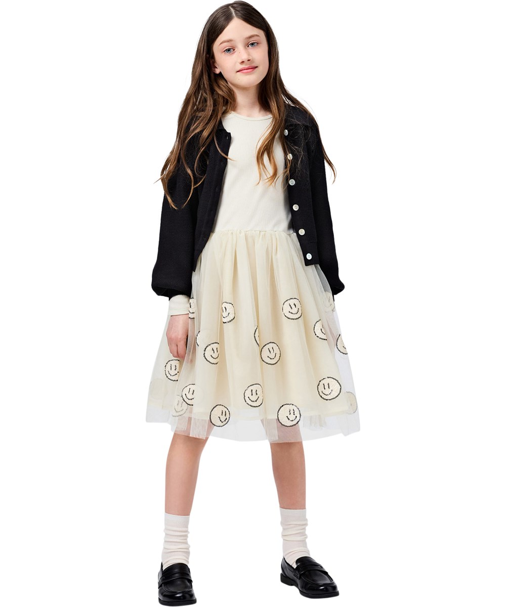 Cyrus - Summer Sand - Off-White-Kleid für Kinder mit langen Ärmeln und einem Tüllrock mit fröhlichen Paillettenblumen