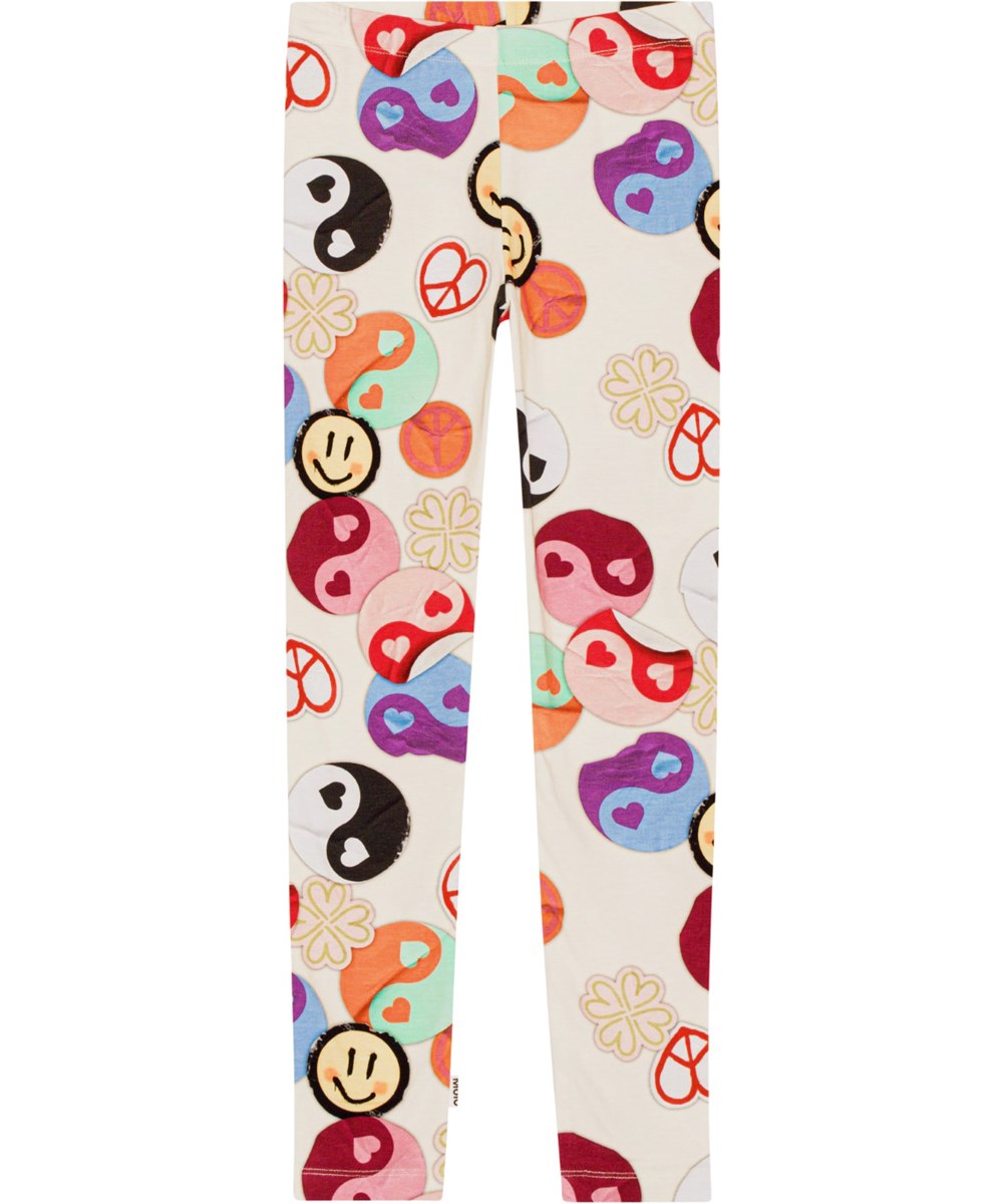 Niki - Yin Yang - Cremefarbene Leggings aus Öko-Baumwolle mit einem Aufdruck aus Yin- und Yang-Aufklebern