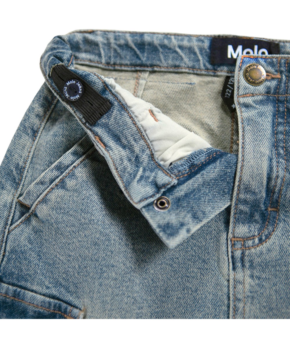 Belli - Vintage Denim - Jeansrock für Kinder aus Öko-Baumwolle mit Cargotaschen an der Seite.