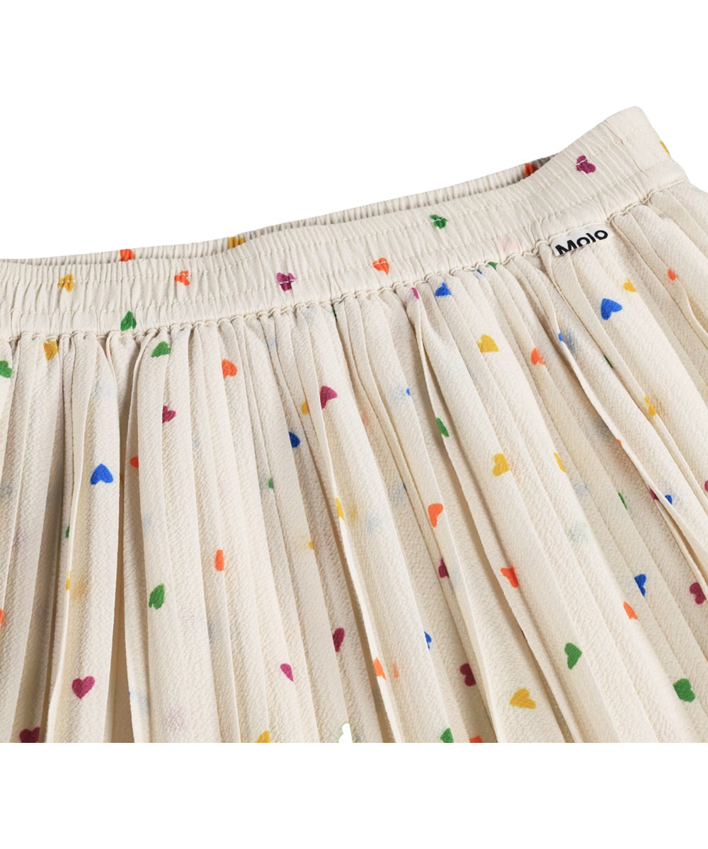 Bess - Confetti_Rainbow - Off-weißer Faltenrock für Kinder mit Herzmuster