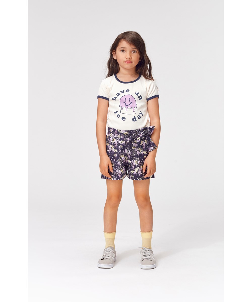 Alysse - Mini Wisteria - Öko-Shorts mit Blumendruck und Schleife