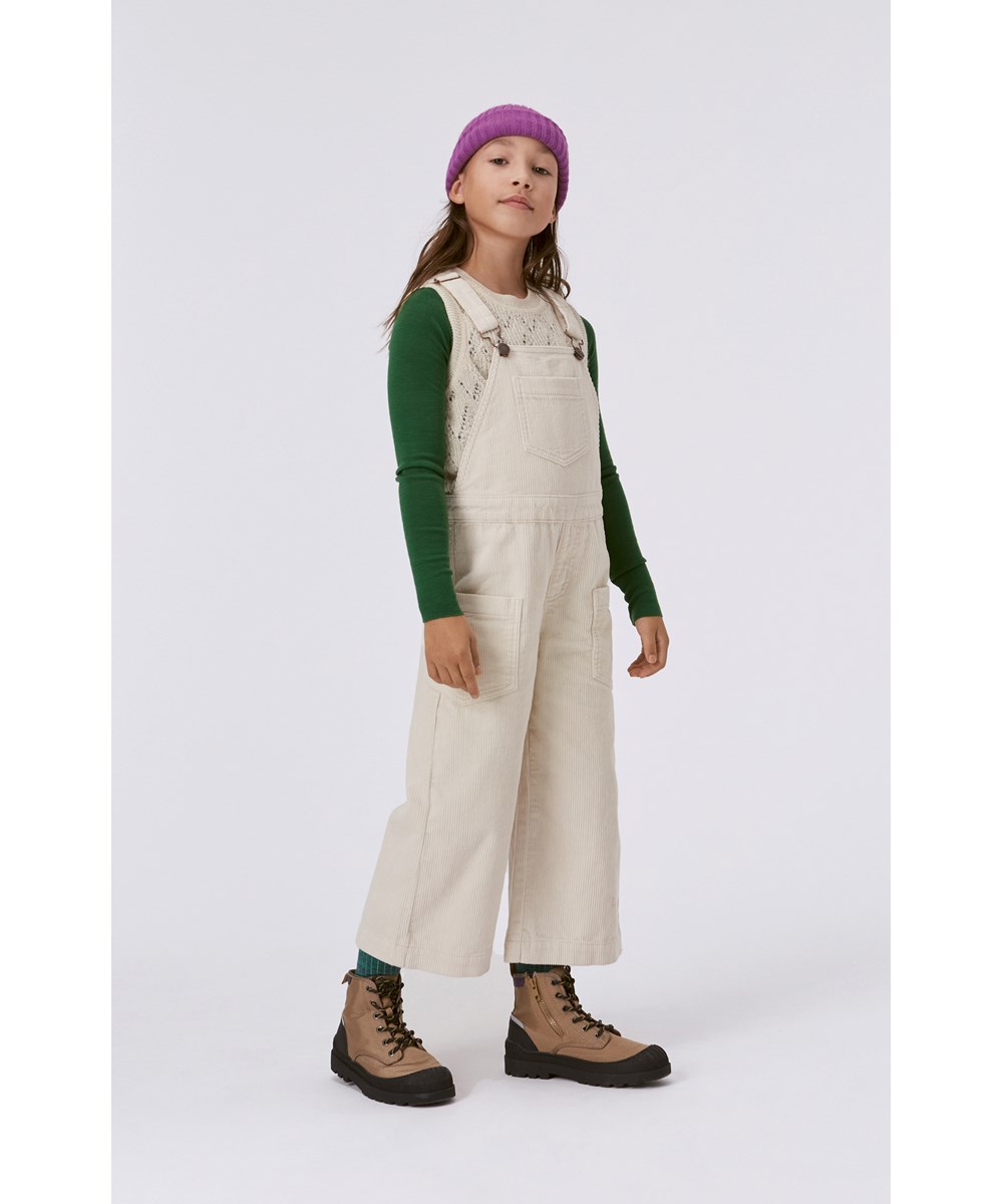 Greta - Pearled Ivory - Wollweiße Strickweste mit Lochmuster