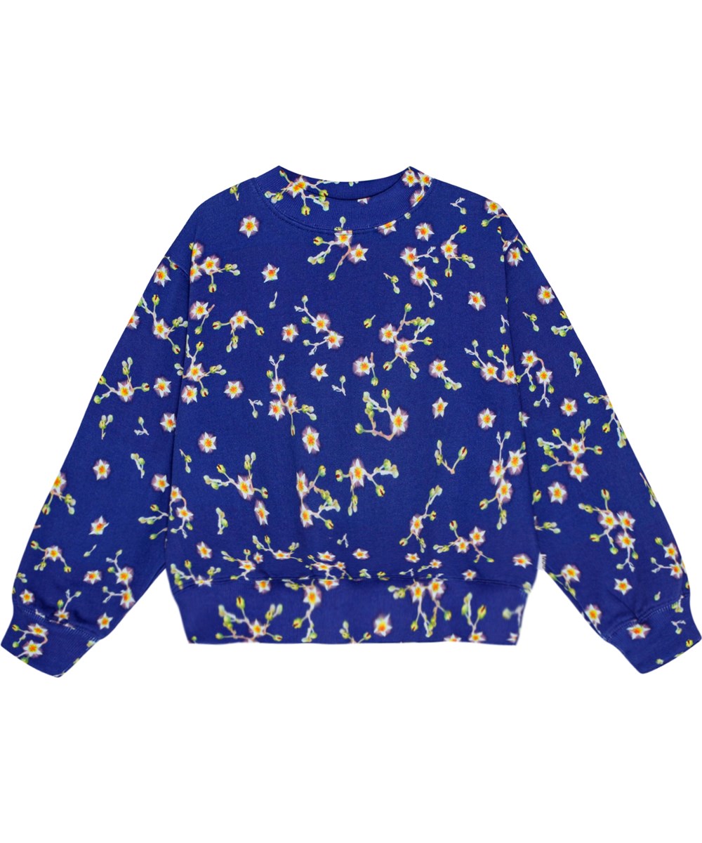 Marge - Flowers Of The Sky - Weiches blauer Öko-Baumwoll-Sweatshirt mit übergroßer Passform und weißem all-over Blumenmuster.