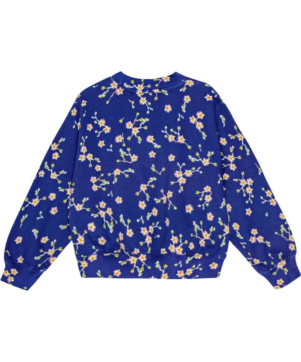 Marge - Flowers Of The Sky - Weiches blauer Öko-Baumwoll-Sweatshirt mit übergroßer Passform und weißem all-over Blumenmuster.