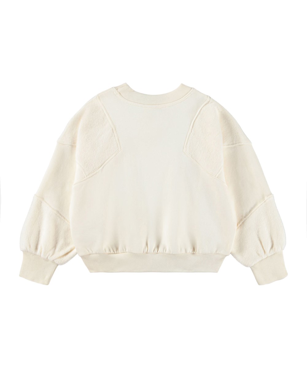 Marion - Buttercream - Cremefarbenes Sweatshirt für Kinder aus Öko-Baumwolle.