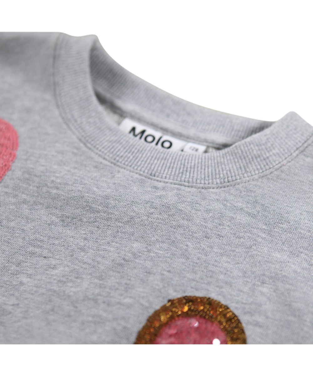 Miki - Grey Melange - Grauer Pullover für Kinder aus Öko-Baumwolle mit einer Stickerei mit Pailletten.