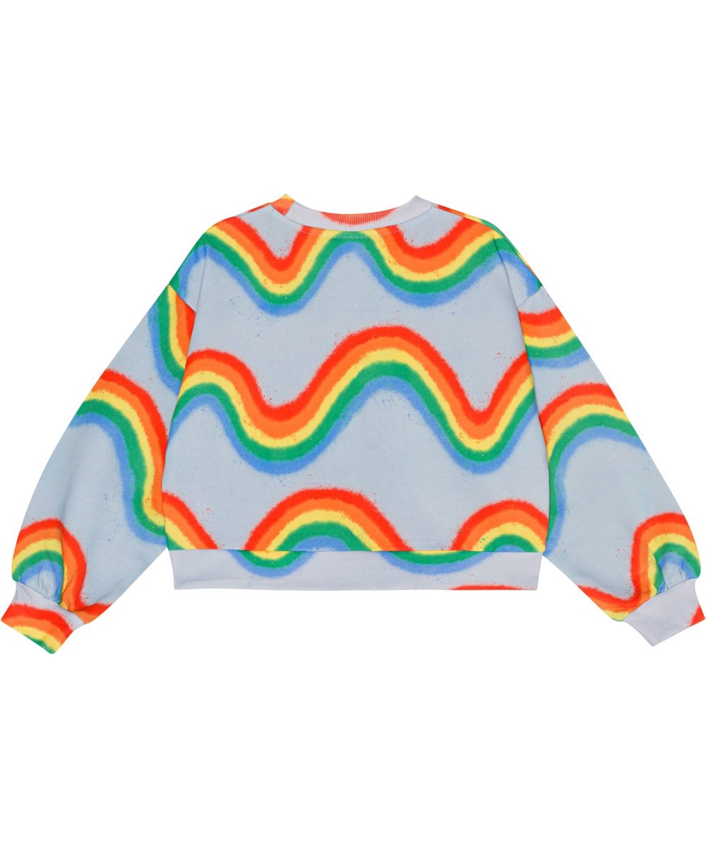 Miki - Rainbow Waves - Hellblaues Sweatshirt aus Öko-Baumwolle mit Regenbogendruck.