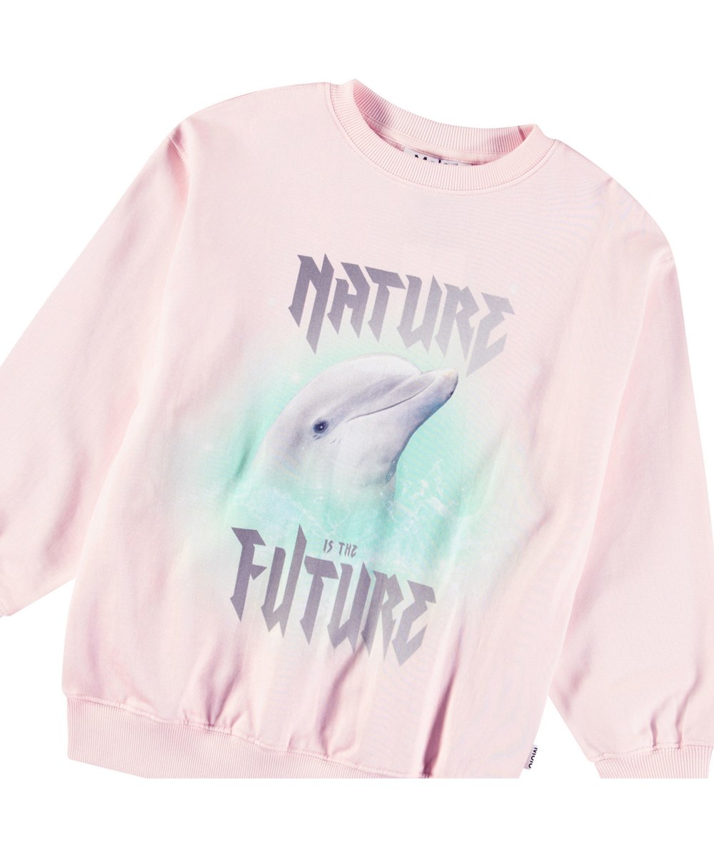 Monti - Glitter Dolphin - Rosa Sweatshirt mit Aufdruck für Kinder aus weicher Öko-Baumwolle mit gerippten Kanten am Hals, an den Ärmeln und am unteren Saum des Sweatshirts.