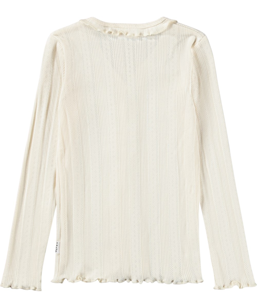 Ramsi - Pearled Ivory - Cremeweiße Strickjacke aus weichem, fein gestricktem Baumwolljersey mit zartem Lochmuster und Rüschen-Details für Kinder.