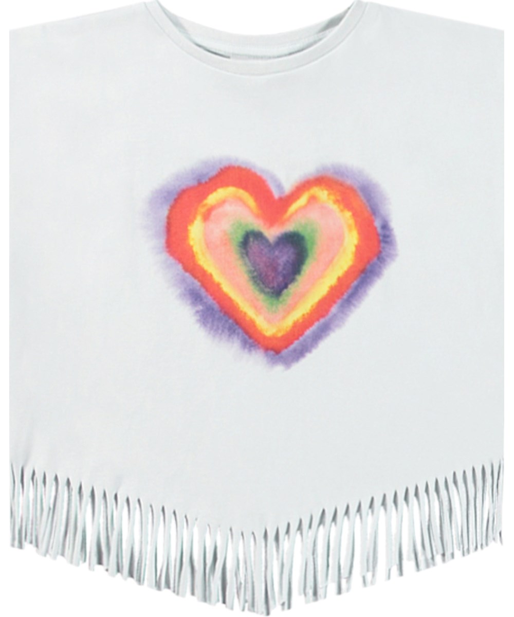 Rassita - Rainbow Heart - Weißes Oversized Oberteil für Kinder aus Öko-Baumwolle mit geripptem Ausschnitt und Fransen am Saum.