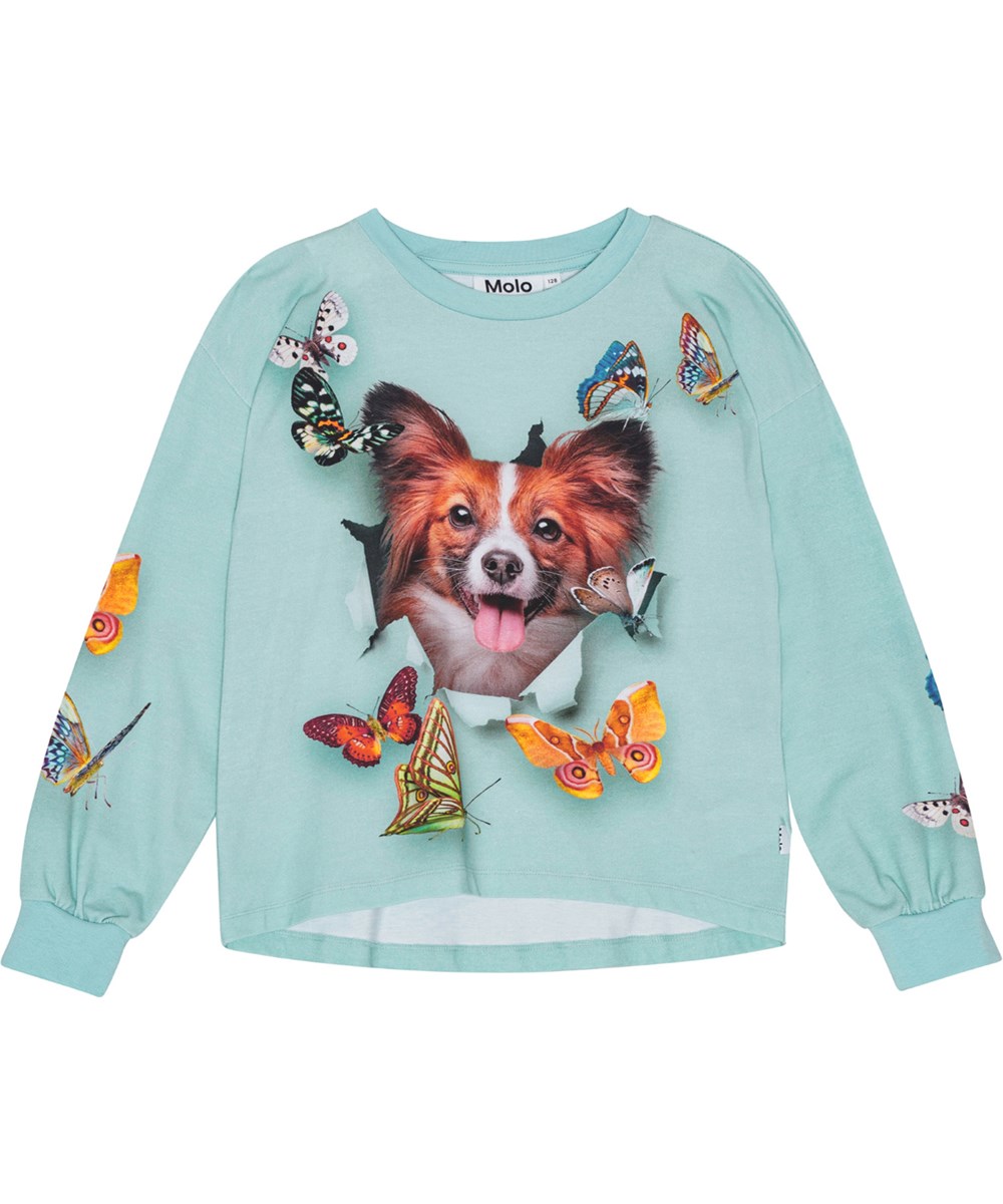 Reniza - Bonjour - Hellblaue Bluse aus Öko-Baumwolle mit lockerer Passform und gerippten Kanten.