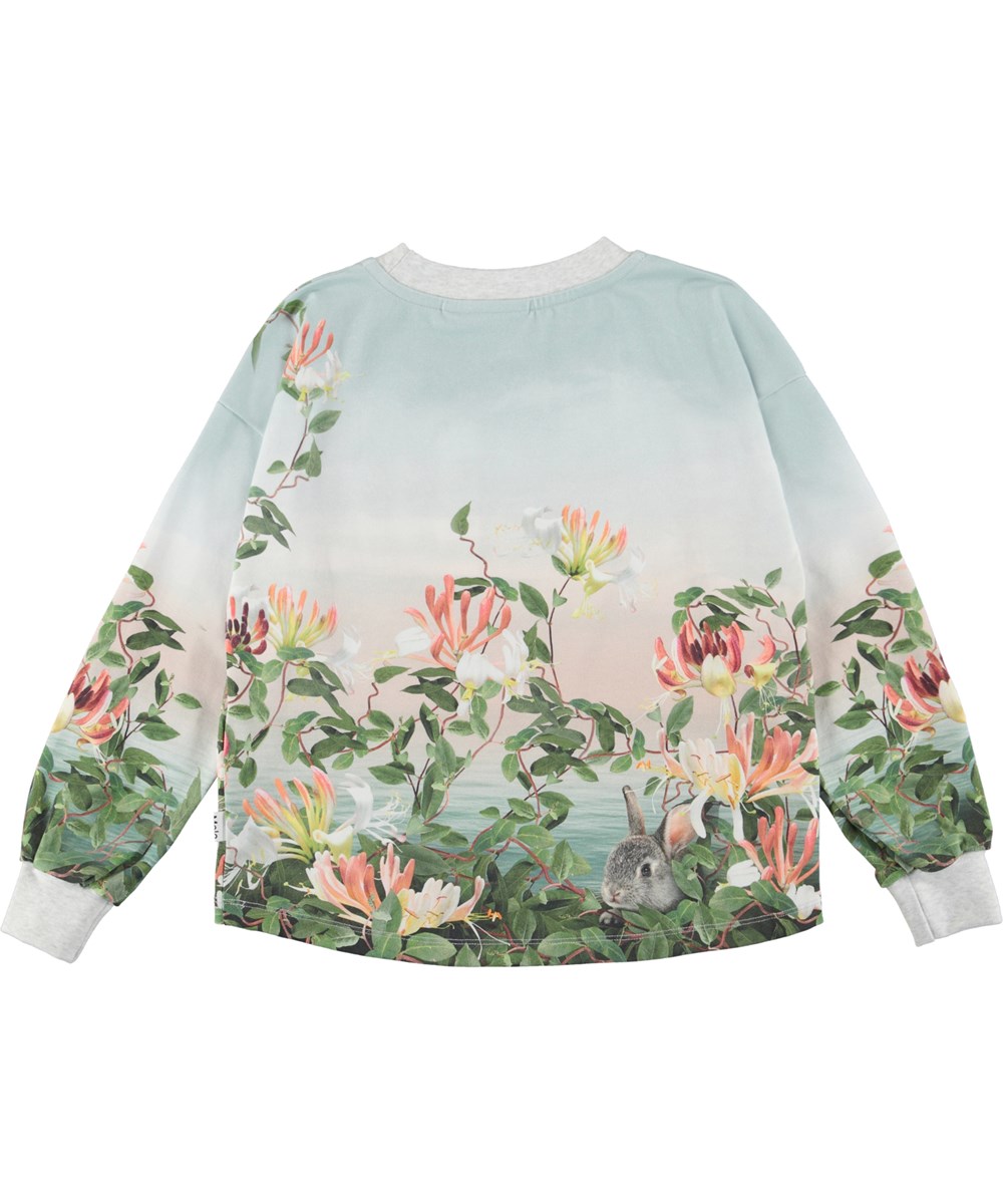 Reniza - Present Dreamers - Öko-Pullover mit Kaninchen, Hund und Blumen.