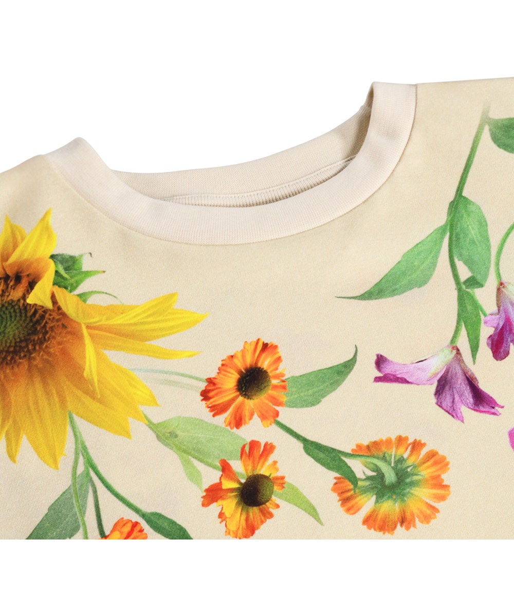 Reniza - Rainbow Flora - Beigefarbenes langärmliges Oberteil für Kinder aus Öko-Baumwolle mit Blumenmuster