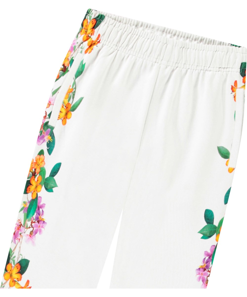 Allen - Jungle Flowers - Witte joggingbroek voor kinderen van biologisch katoen met bloemen uit de jungle.